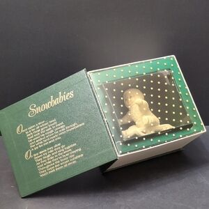 Department 56 Winter Tales Of The Snowbabies,Baby On Sled Figurine.